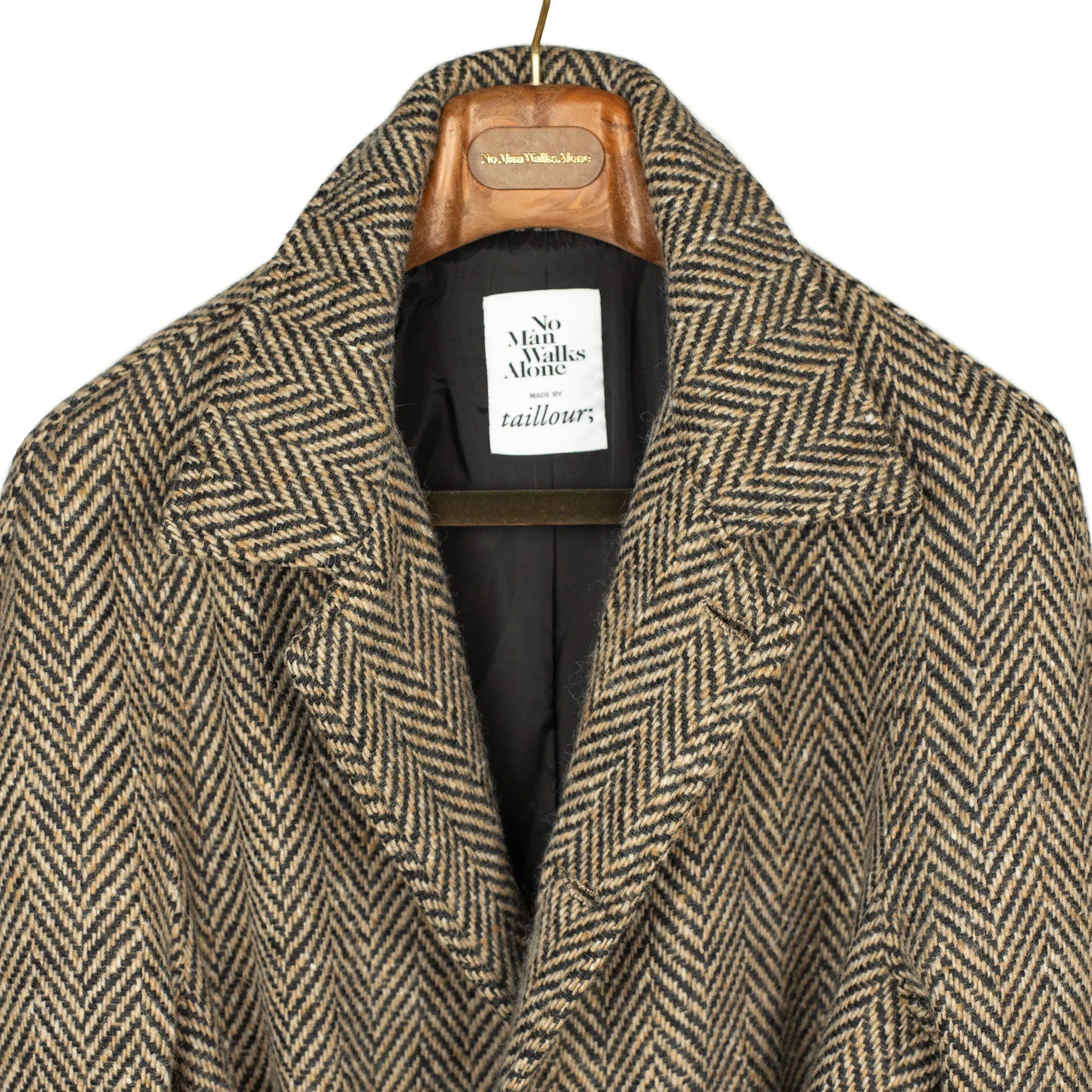 Belted balmacaan coat in handloomed Donegal oatmeal-black herringbone tweed